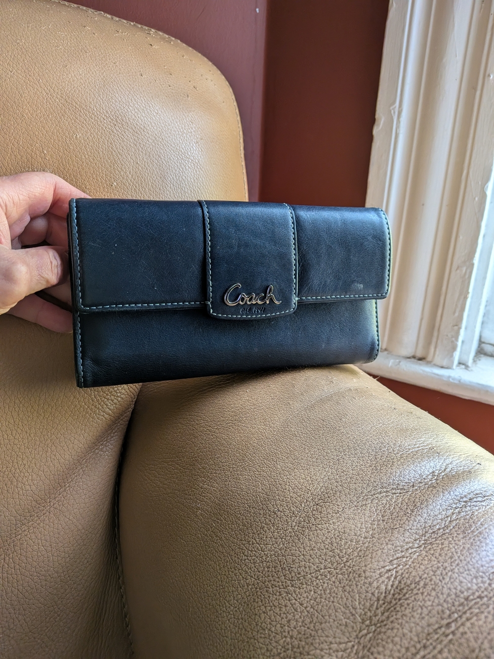 Coach Navy Leather Fold-Over Continental Wallet with pink interior